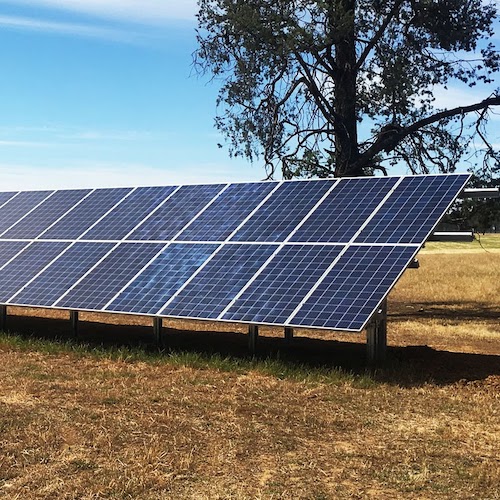 Solar Panel Ground Mounted on Side of Hill