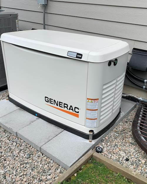 Generac generator installed at side of house